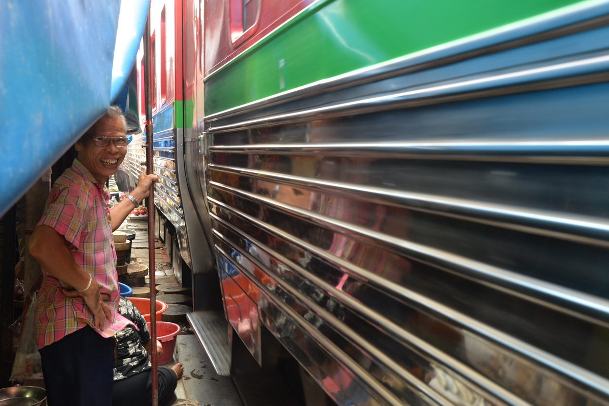 In A Tight Spot | Maeklong Railway Market, Thailand photograph 11